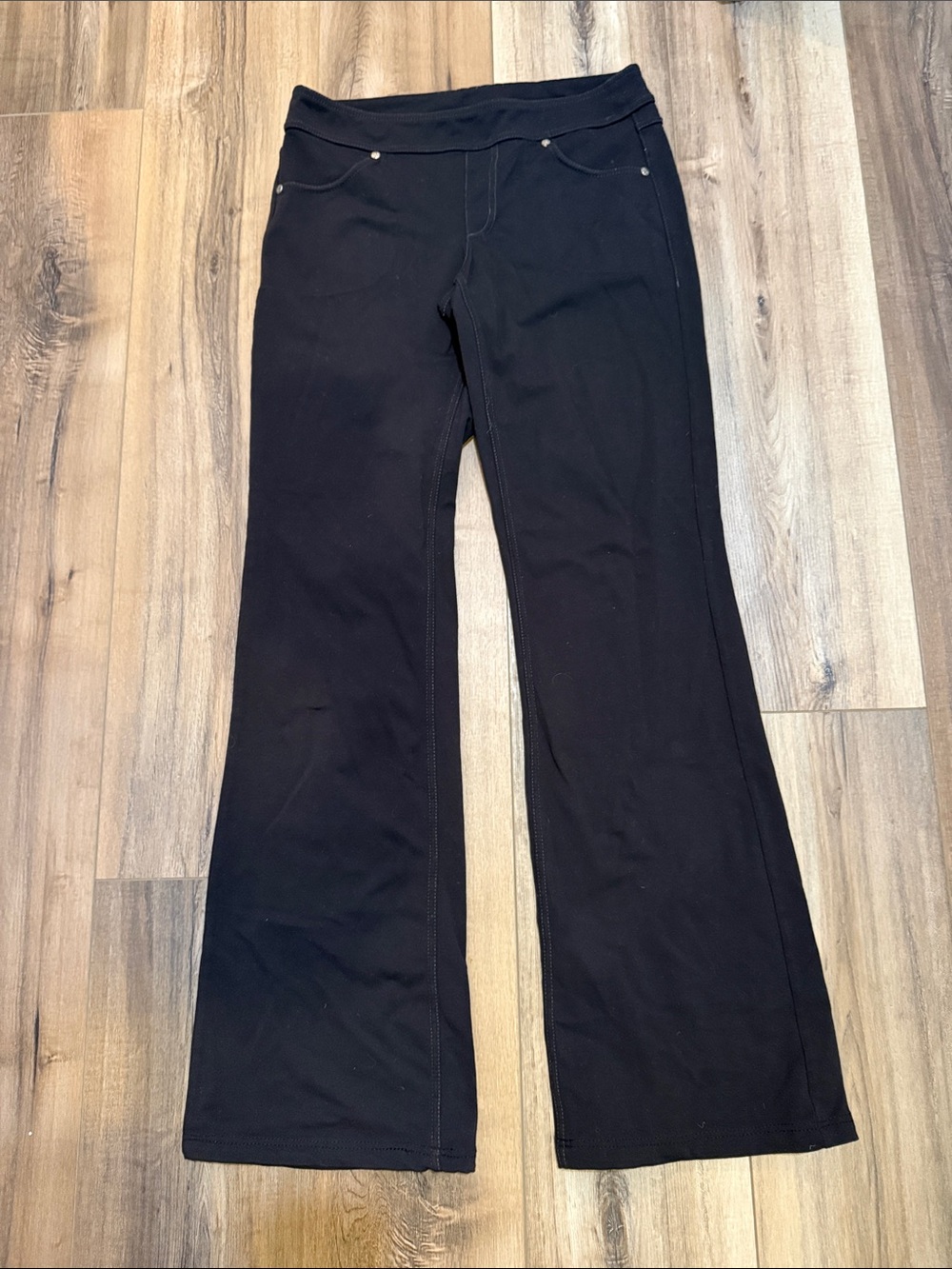 Athleta Bettona Classic Black Flare Pants on a women’s small tall